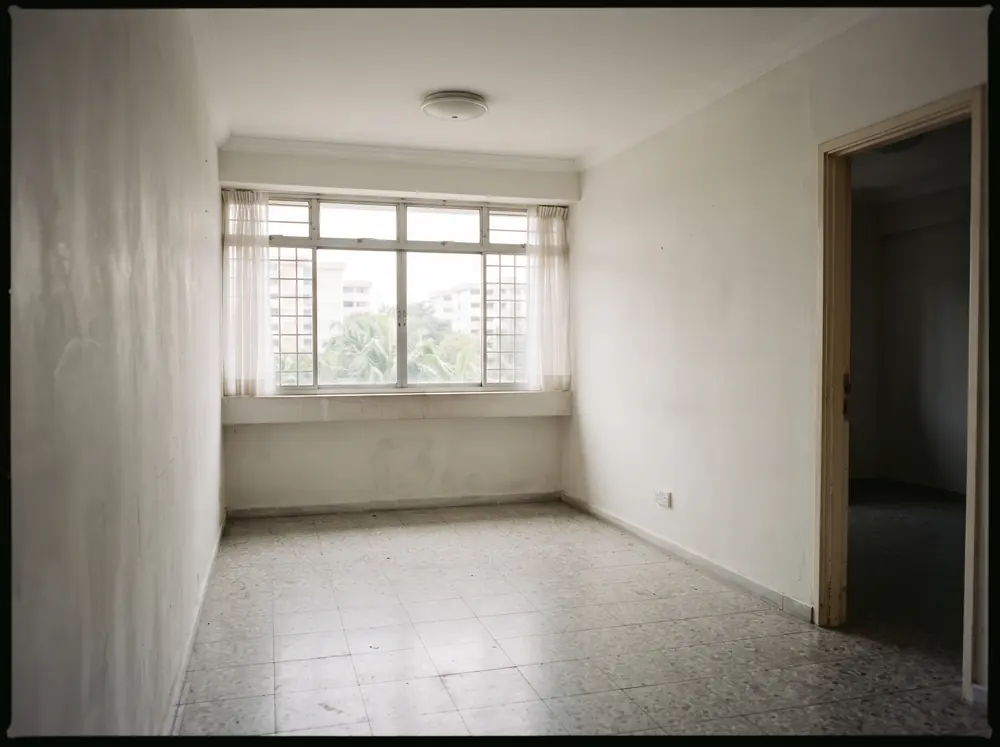 An empty apartment room with bare walls